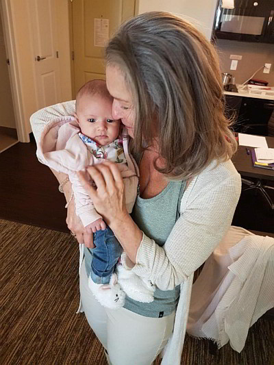 Vannette with baby in her clinic